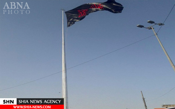 اهتزاز بزرگترین پرچم حضرت زهرا (س) در نجف + تصویر